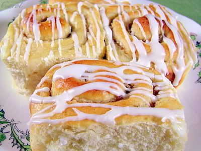 /><br/> <br/> BANANA-PECAN SWEET ROLLS<br/> (Source: adapted from Taste of Home Holidays and Celebrations Cookbook 2007)<br/> <br/> <br/> DOUGH:<br/> 4 3/4-5 c. bread flour<br/> 1/4 c. sugar<br/> 4 1/2 tsp. instant yeast (or 2 (1/4 oz. each) pkg. quick-rise yeast)<br/> 1 tsp. salt<br/> 1 c. milk<br/> 1/4 c. butter, cubed<br/> 1 c. mashed ripe bananas (about 3 medium)<br/> 1 egg<br/> 1 tsp. vanilla extract<br/> <br/> <br/> FILLING:<br/> 3 Tbsp. butter, melted<br/> 1/2 c. chopped pecans<br/> 1/4 c. sugar<br/> 1/2 tsp. ground allspice<br/> <br/> <br/> ICING*:<br/> 2 c. confectioners' sugar<br/> 1 Tbsp. lemon juice<br/> 1-2 Tbsp. milk<br/> <br/> <br/> In a large mixing bowl, combine 2 c. flour, sugar, yeast and salt.<br/> In a small saucepan, heat milk and butter to 120-130 degrees. Add to dry ingredients; beat just until moistened. Add the bananas, egg and vanilla; beat until smooth. Stir in enough remaining flour to make a soft dough (dough will be sticky).<br/> <br/> <br/> Turn onto a lightly floured surface; knead until smooth and elastic, about 6-8 minutes. Place in a greased bowl, turning once to grease top. Cover; let rise in a warm place until doubled, 45-60 minutes.<br/> <br/> <br/> Punch down dough. Turn onto a lightly floured surface; divide dough in half. Roll each half into a 15x6-inch rectangle. Brush with melted butter to within 1/2